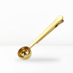 Cuchara medidora de café dorada